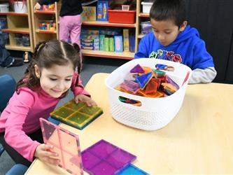 TK students playing with magna tiles