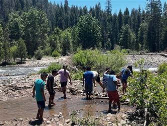 phot of students in summer program exploring water life at camp tehama