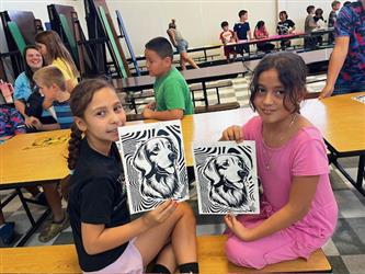 photo of students in summer program with finished screen print photos